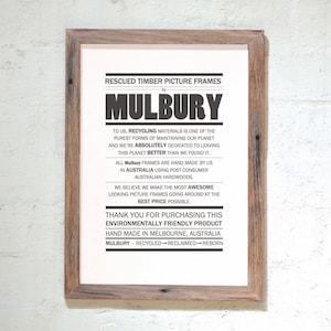 May include: A black and white poster with the text "RESCUED TIMBER PICTURE FRAMES by MULBURY". The poster describes the company's commitment to recycling materials and making environmentally friendly picture frames. The poster also states that the frames are hand-made in Melbourne, Australia.