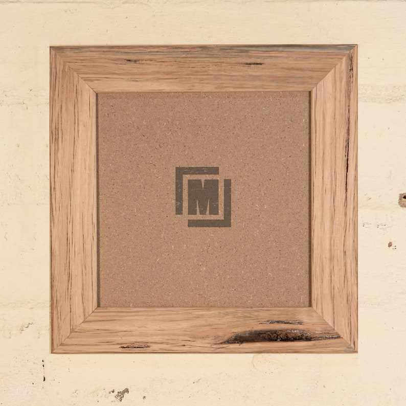 May include: A square wooden picture frame with a natural wood finish. The frame has a rustic look with knots and grain patterns. The frame is empty and ready to display a photo or artwork.
