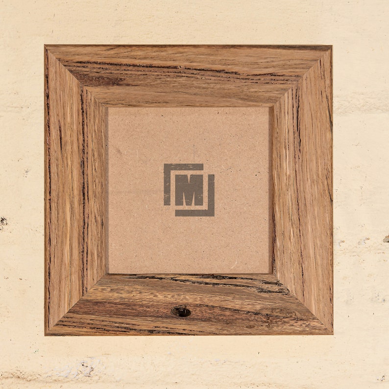May include: A rustic wooden picture frame with a brown cardboard backing. The frame has a natural wood grain pattern and a dark brown finish. The frame is empty and ready for a photo or artwork.