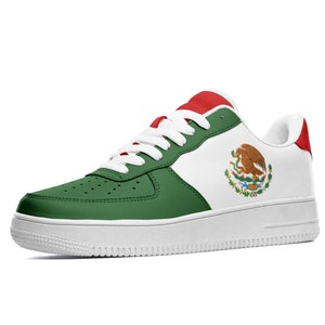 May include: White, green, and red low-top sneakers with the Mexican flag on the side.