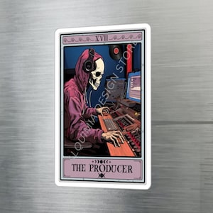May include: A tarot card illustration of a skeleton wearing a pink hoodie and headphones, sitting at a soundboard with a computer screen in the background. The card is titled "The Producer" and has the number XVII on it.