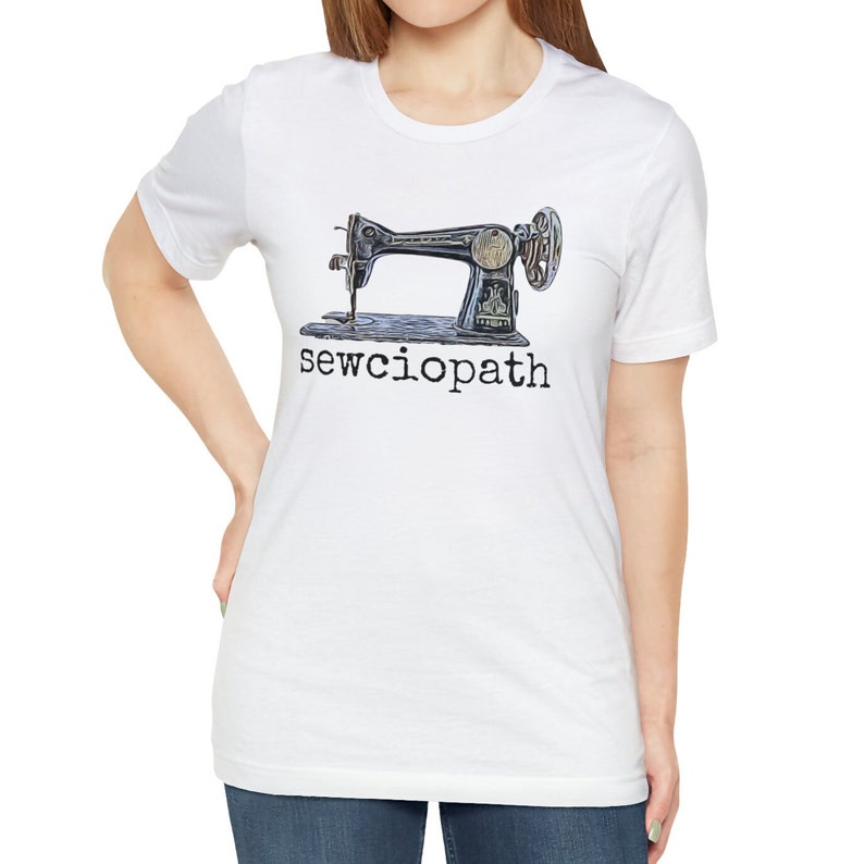 May include: White t-shirt with a vintage sewing machine graphic and the text "sewciopath" printed in black.