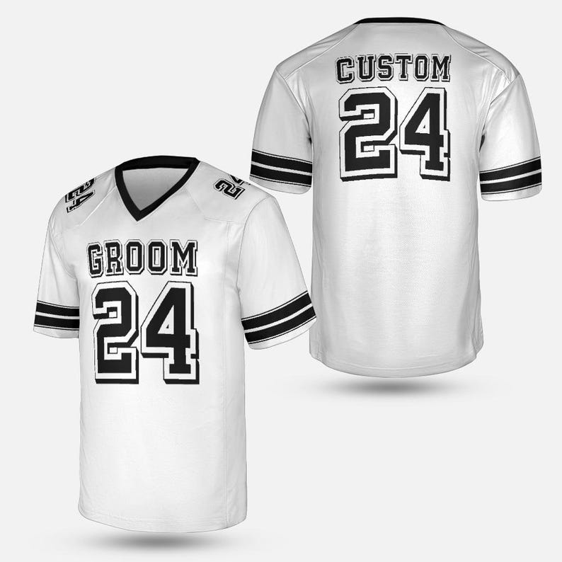May include: White football jersey with black accents and the number 24. The front of the jersey reads "GROOM" above the number 24. The back of the jersey reads "CUSTOM" above the number 24. The jersey has black stripes on the sleeves.