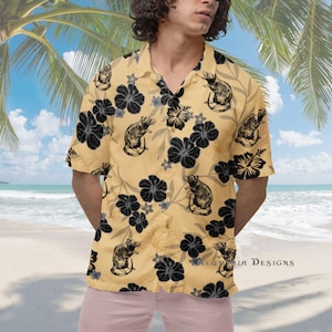 May include: A short-sleeved, button-down shirt in a light tan color, featuring a repeating pattern of black flowers and rat illustrations. The shirt has a classic collar and is made of a lightweight fabric, perfect for warm weather.