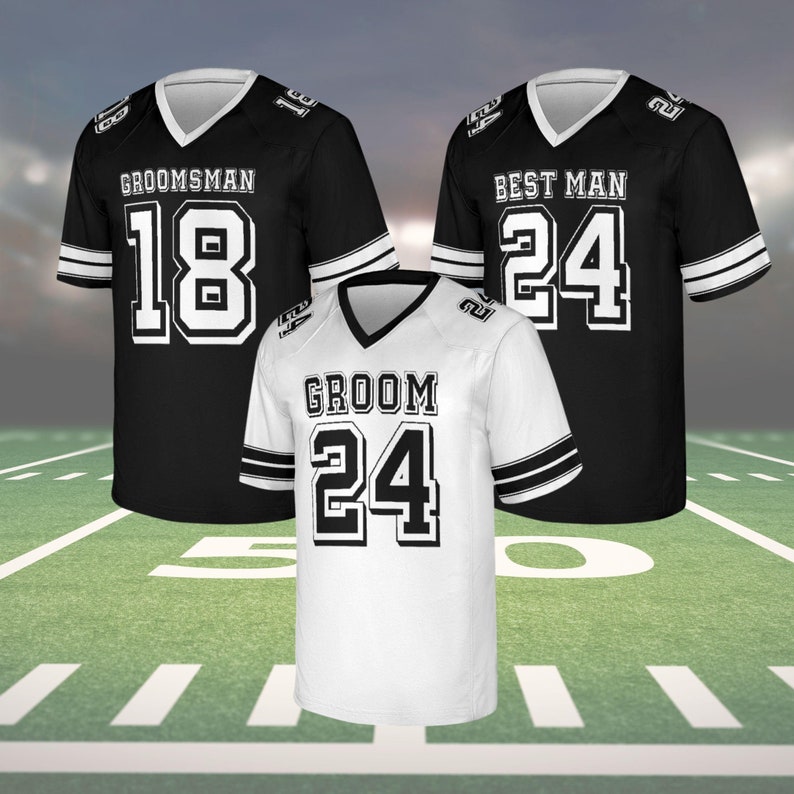 May include: Three football jerseys: two black and one white. The black jerseys have white lettering that reads "GROOMSMAN" and "BEST MAN" with the numbers 18 and 24. The white jersey reads "GROOM" with the number 24. All jerseys have a V-neck and striped sleeves.