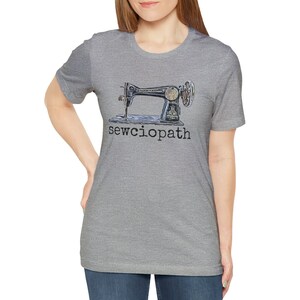 May include: A heather gray t-shirt with a vintage sewing machine graphic and the text "sewcioptah" printed on the front.