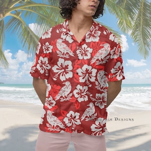 May include: A red short-sleeved button-down shirt with a white floral and raven print. The shirt has a relaxed fit and a collar.