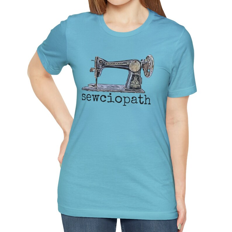 May include: A light blue t-shirt with a vintage sewing machine graphic and the text "sewciophat" printed on the front.