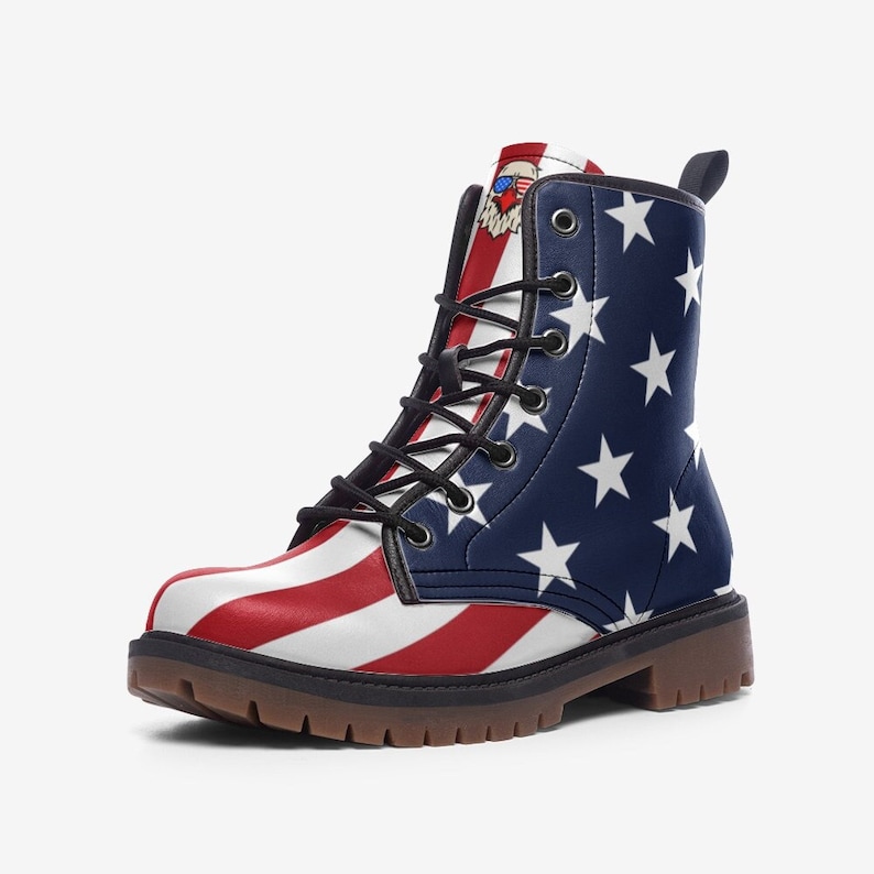 May include: Red, white and blue American flag print lace-up boots with a brown sole.