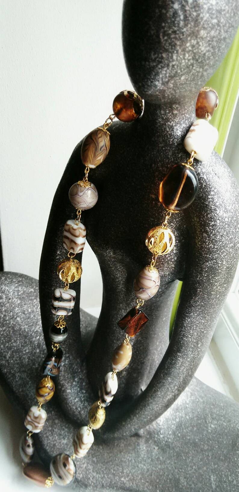 Neutral beaded necklace made with a variety of quality beads