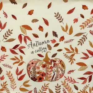 May include: A white background with a floral pumpkin in the center. The pumpkin is surrounded by brown and orange leaves. The text "Autumn is calling" is written in black cursive above the pumpkin.