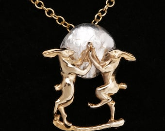 Boxing Hares against the Moon, in18 Carat Gold on Sterling Silver.
