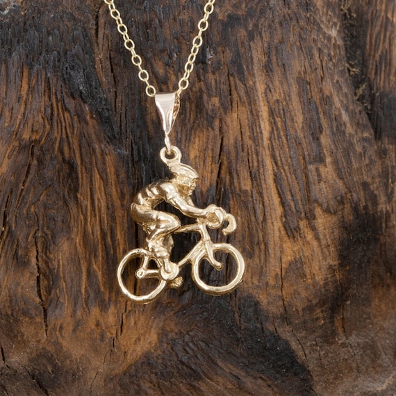 ciclista en oro macizo. Etsy