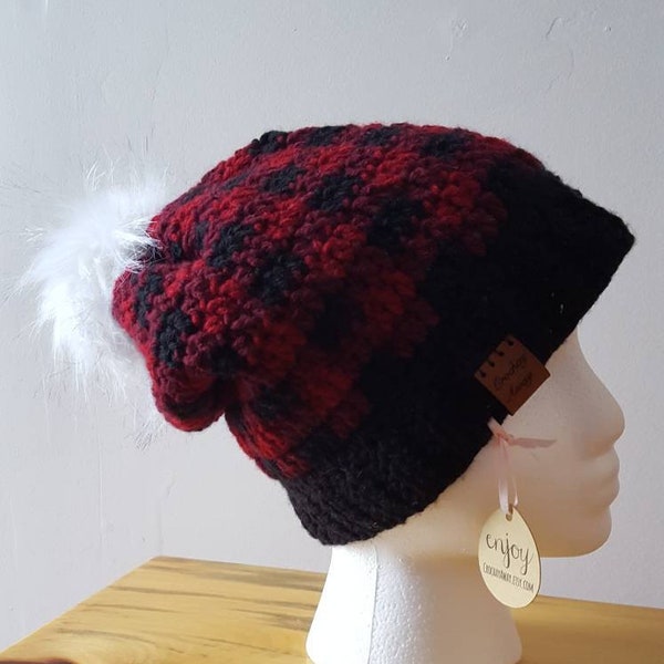 Plaid slouchy hat with white fur pompom.