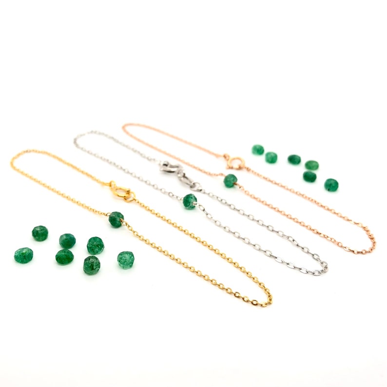 A Green Emerald bracelet features a faceted real Green Emerald that is centered on a 7" cable link SILVER or GOLD-FILLED dainty cable link chain. 
Bring flair to your style, wear it alone or layer it with chains from our collection.