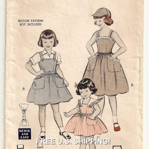 May include: Vintage sewing pattern for three girls' dresses. The pattern includes a sleeveless dress with a lace trim, a dress with a bib and pockets, and a dress with a sailor collar and pockets. The pattern is printed on a light brown background with black and white illustrations.