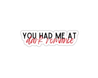 May include: A white sticker featuring the phrase "YOU HAD ME AT dark romance". The words "YOU HAD ME AT" are in a bold, black font, and "dark romance" is in a red, cursive font.