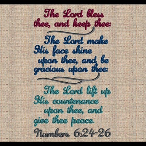 May include: Embroidered artwork featuring a religious verse from Numbers 6:24-26. The text, in shades of red, blue, and teal, is stitched onto a textured beige fabric, framed by a black border. The script reads "The Lord bless thee, and keep thee."