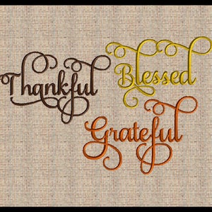 May include: An embroidered design featuring the words "Thankful", "Blessed", and "Grateful" in a cursive script. The words are in different colours: brown, yellow, and orange.
