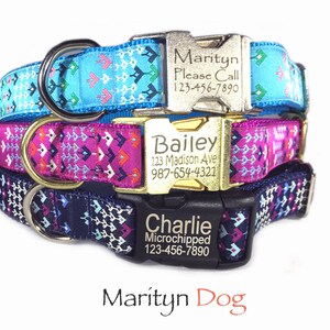 May include: Three dog collars with personalized engraved tags. The top collar is blue with a white and pink geometric pattern. The middle collar is pink with a white and black geometric pattern. The bottom collar is navy blue with a white and pink geometric pattern. The tags read "Marityn Please Call 123-456-7890", "Bailey 123 Madison Ave 987-654-4321", and "Charlie Microchipped 123-456-7890".