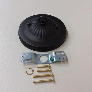 May include: Black metal ceiling light fixture with a decorative ring and a hanging hook. The fixture comes with a metal mounting plate, four screws, and a washer.