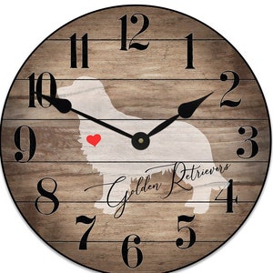 May include: A wooden clock with a silhouette of a golden retriever and the text "Golden Retrievers". The clock face has Roman numeral hour markers and black hands.