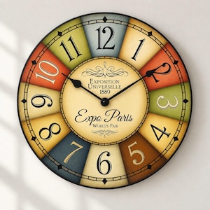May include: A round wall clock with a black frame and a multi-colored segmented face. The center features the text Exposition Universelle 1889 and Expo Paris World's Fair. Black hands indicate the time against large black numerals.