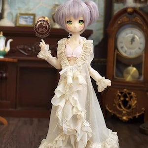 May include: A doll with lavender hair and green eyes, wearing a cream-colored ruffled robe and a pink bra. The doll is standing in a room with antique furniture and decor, including a grandfather clock and a fireplace.