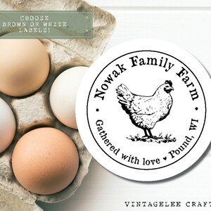 May include: A carton of eggs with brown and white shells. A round label features a hen illustration and the text "Nowak Family Farm, Gathered with love, Pound, WI". The text "Choose brown or white labels!" is also visible.