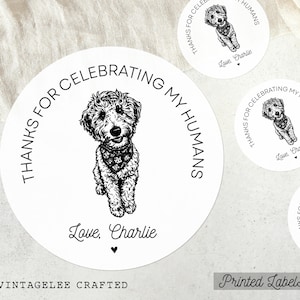 May include: White round labels with a black and white illustration of a dog wearing a bandana. The text "THANKS FOR CELEBRATING MY HUMANS" encircles the dog. The labels are signed "Love, Charlie" and the text "VINTAGELEE CRAFTED" is at the bottom.
