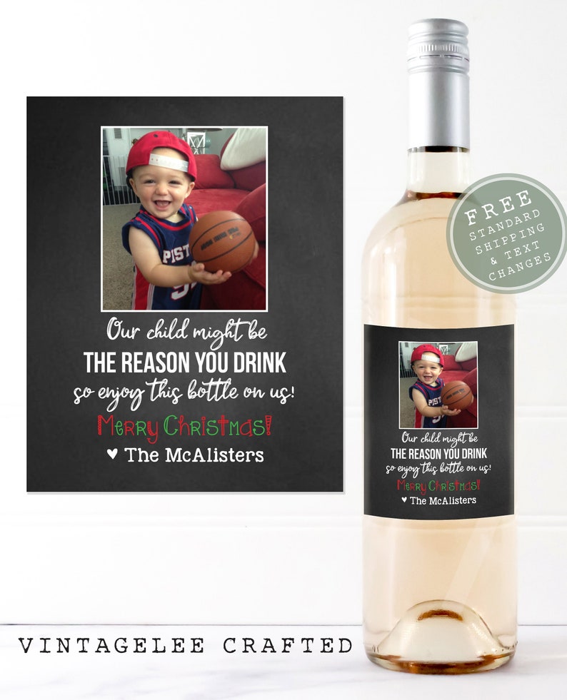 May include: A printable wine bottle label with a chalkboard background featuring a photo of a young child holding a basketball. The text reads "Our child might be THE REASON YOU DRINK so enjoy this bottle on us! Merry Christmas! The McAlisters."