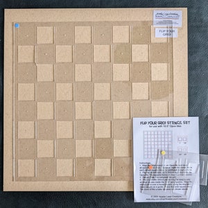 May include: A stencil set for 10.5" Opus tiles. The set includes a grid stencil with a clear overlay, a small instruction sheet, and two smaller stencils. The text "FLIP YOUR GRID!" is visible on the stencil and instruction sheet.