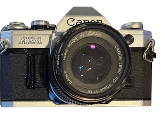 Vintage Canon AE-1 35mm SLR Film Camera with 50mm f/1.8 Lens - Classic Silver Chrome