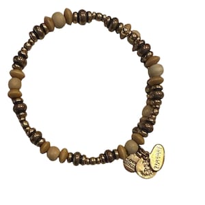 May include: A beaded bracelet featuring a mix of wooden and metallic beads in shades of brown and gold. The bracelet includes small, round beads and larger, irregularly shaped beads. Two gold-colored charms hang from the bracelet.