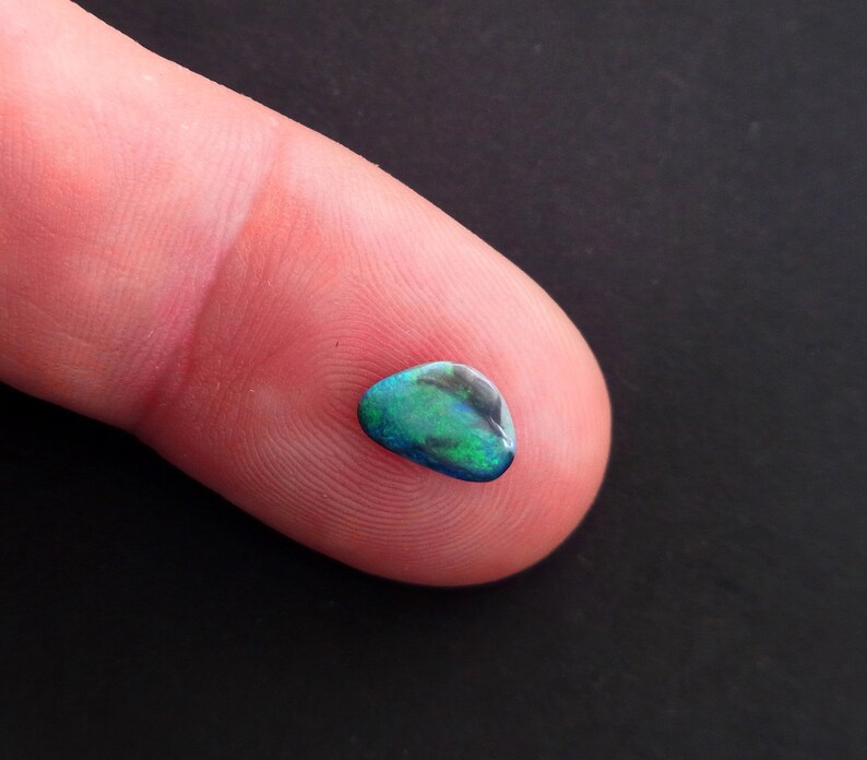 Black Opal Freeform Cabochon Lightning Ridge Green and turquoise pinfires 9.5 x 6.5 mm approx.Item 378