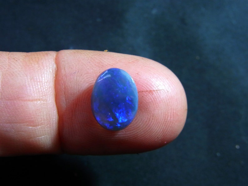 Item 1319 11.5 x 8.5 mm approx Ring Stone Pendant Bright Black Opal Oval Cabochon BlueGreen sparkles light blue base  Lightning Ridge