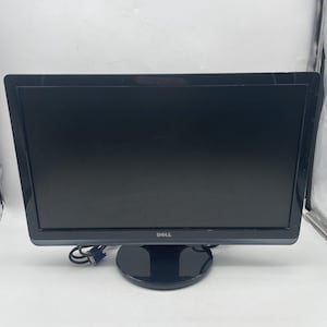 May include: A black Dell computer monitor with a glossy screen and a rounded base. The monitor has a black bezel and a power cable connected to the back. The Dell logo is visible on the front.