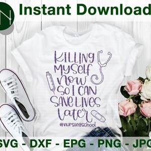 May include: A white t-shirt with purple text that reads "KILLING MYSELF NOW SO I CAN SAVE LIVES LATER" and the hashtag #nursingschool. The text is surrounded by a stethoscope, a syringe, and a bandage.
