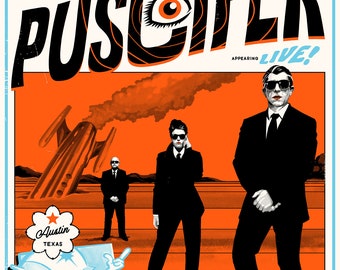 May include: A concert poster for the band Puscifer, featuring a stylized eye and the text "WATCH THE SKIES..." and "LIVE!" The poster is set against a bright orange background with a rocket ship and three figures in black suits.