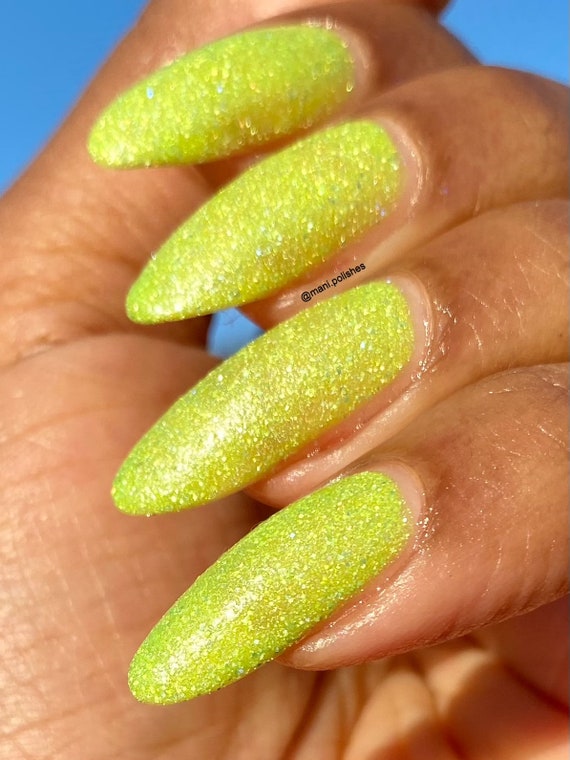 Female Hands with Neon Yellow Nail Design. Glitter Yellow Nail Polish  Manicure. Female Hands on Green Fabric Background Stock Photo - Image of  hands, nails: 251360854