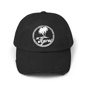 May include: Black distressed baseball cap with a white logo featuring palm trees and the text "The Azores".