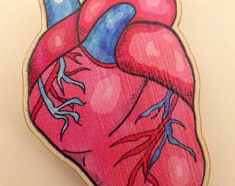 Broche de corazón palpitante