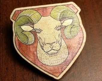 Broche de cabeza de Ram