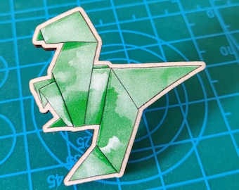 Pin de dinosaurio de origami de madera