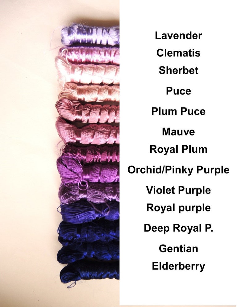 May include: A collection of 12 spools of embroidery floss in shades of purple, pink, and blue. The floss is arranged in order from lightest to darkest, with the names of each color listed to the right. The colors are: Lavender, Clematis, Sherbet, Puce, Plum Puce, Mauve, Royal Plum, Orchid/Pinky Purple, Violet Purple, Royal Purple, Deep Royal P., Gentian, and Elderberry.