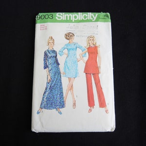 May include: Simplicity sewing pattern number 9003 for a dress with a long skirt and a short-sleeved top. The pattern includes three different styles: a blue dress with a floral print, a blue dress with a solid colour, and a red dress with a solid colour. The pattern is for misses sizes 14 and bust 36.