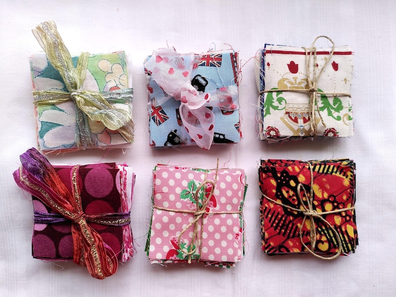 6 stacks of mini charm fabrics 2 and a half inches square in vintage floral, novelty London and floral or spotty motifs