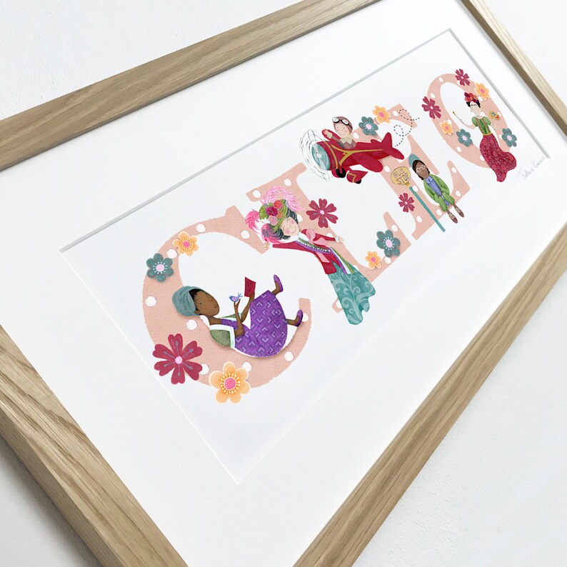 May include: A framed print with the name "CLARA" spelled out in large, colorful letters. Each letter is decorated with a different illustration of a person in a unique outfit and a floral design.