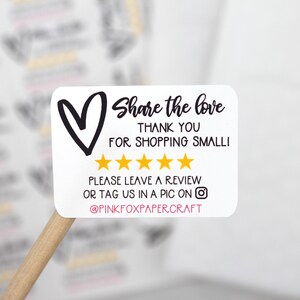 May include: White sticker with a black heart, the text "Share the love", "Thank you for shopping small!" and five gold stars. The text "Please leave a review or tag us in a pic on @PINKFOXPAPERCRAFT" is also included.