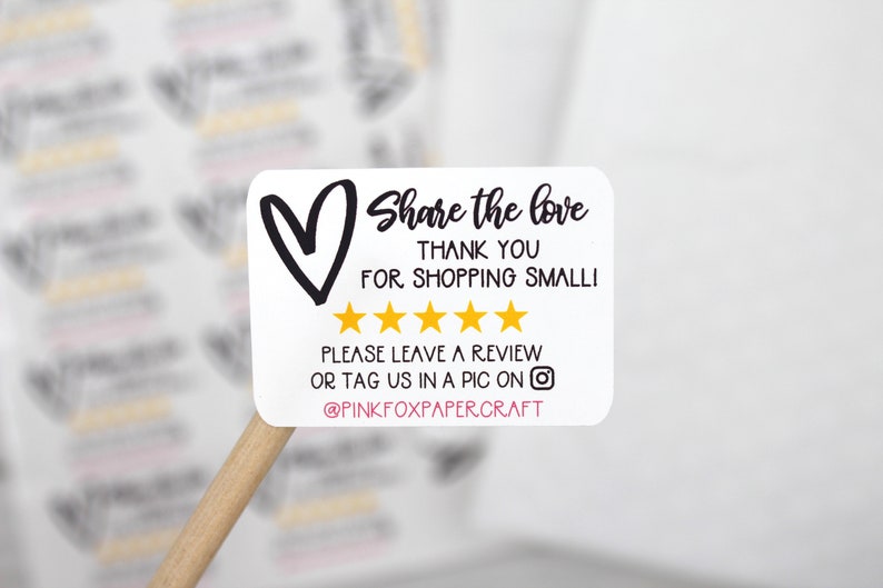May include: White sticker with a black heart, the text "Share the love", "Thank you for shopping small!" and five gold stars. The text "Please leave a review or tag us in a pic on @PINKFOXPAPERCRAFT" is also included.